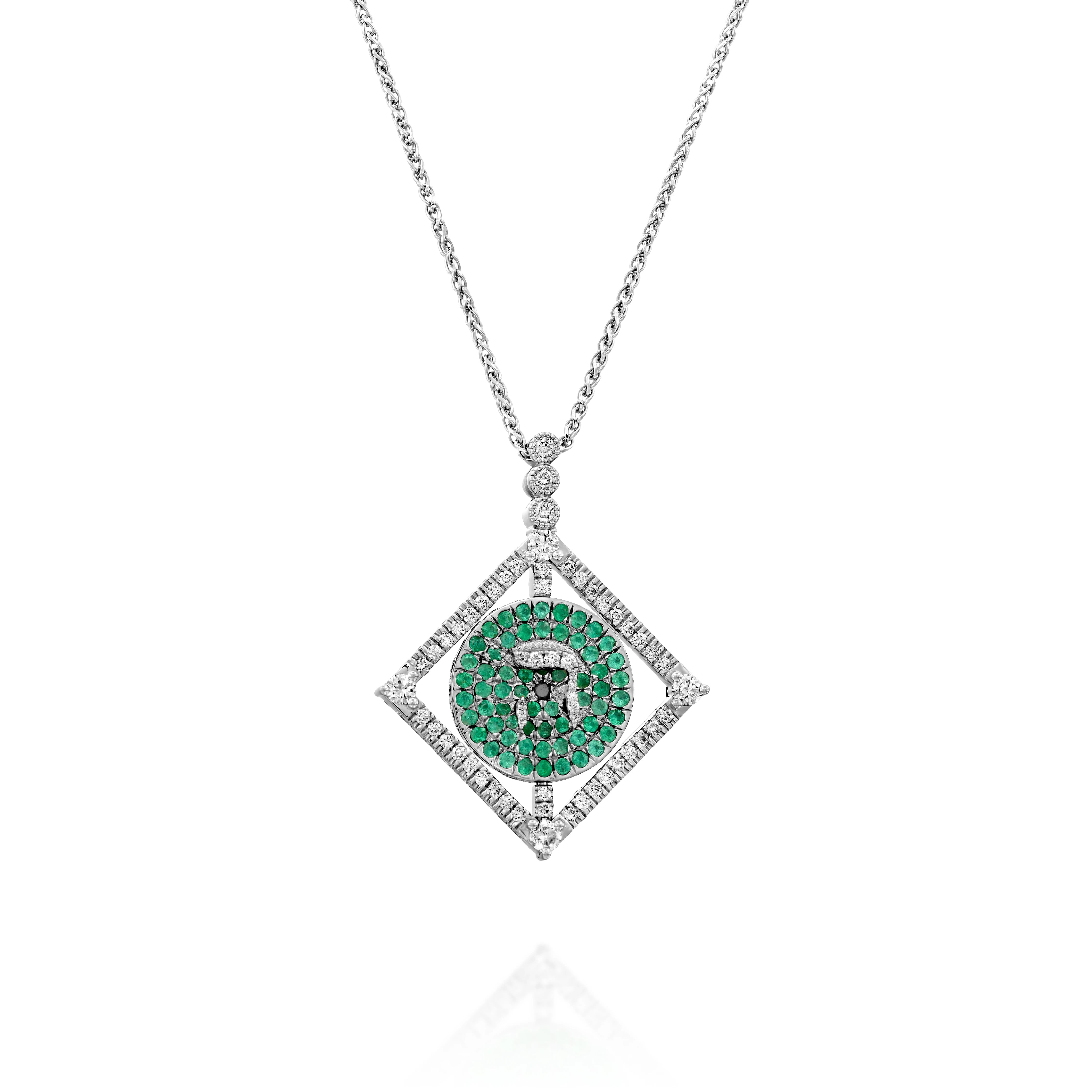 A circular rotating plate hangs gently within a platinum double-sided square pendant set with round brilliant diamonds.