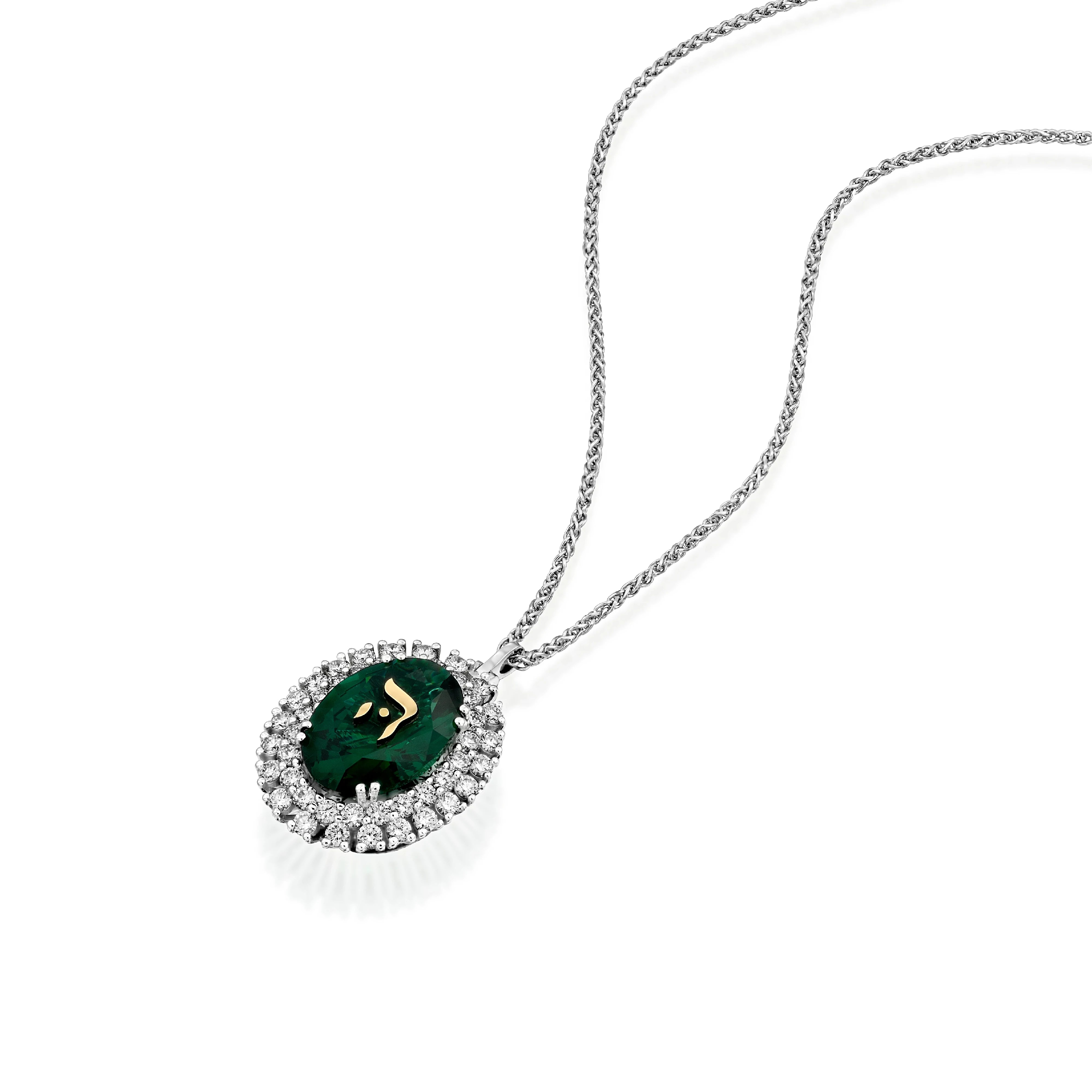 A classic Emerald pendant, adorned with the Hebrew letter “Hei” (‘ה) in yellow gold.