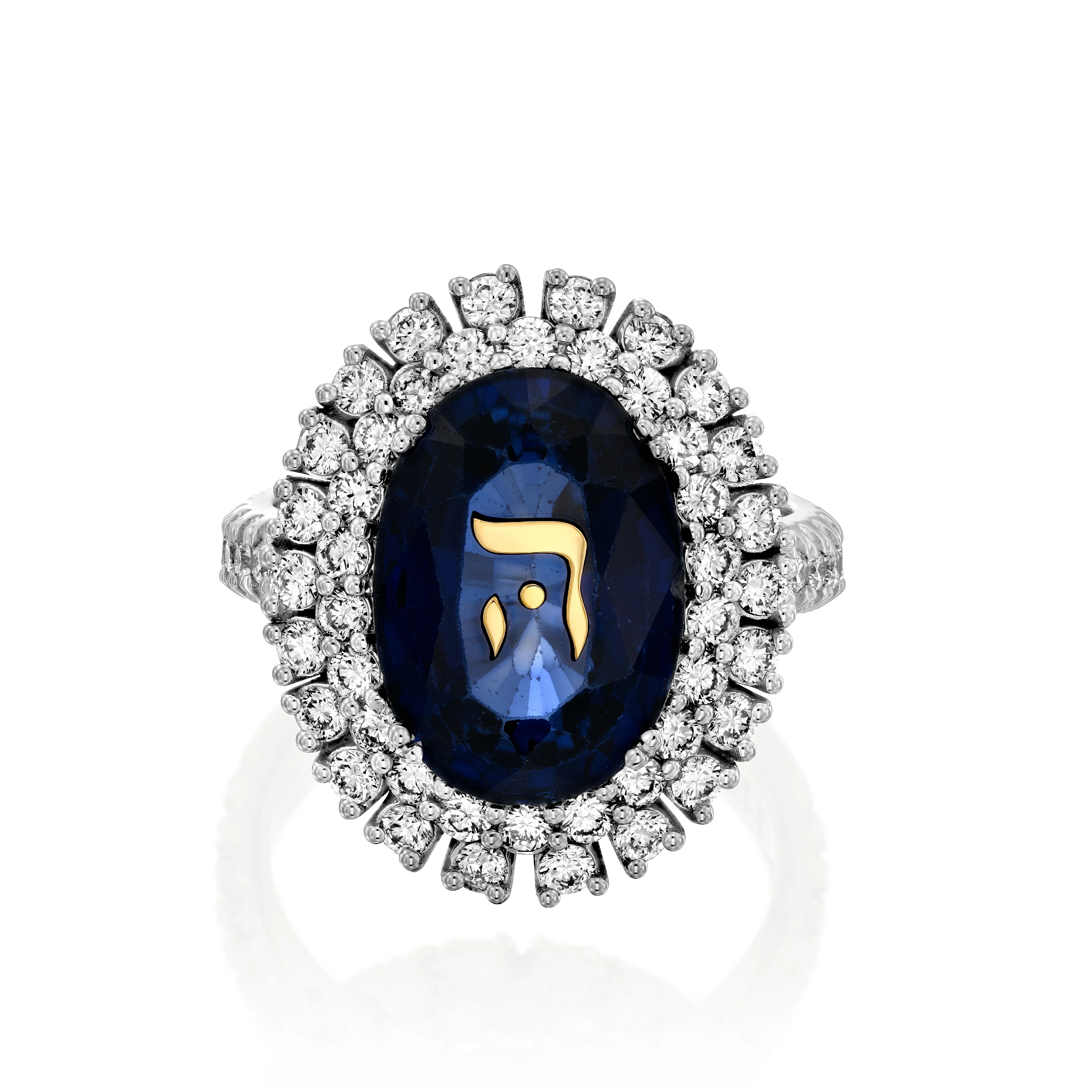 A sapphire ring set in 18k white gold adorned with the Hebrew letter “Hei”(‘ה).